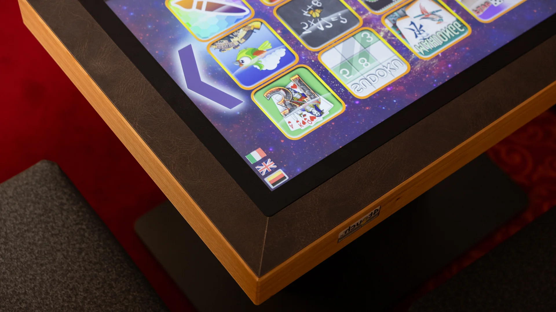 Touchscreen with colorful game tiles on a table