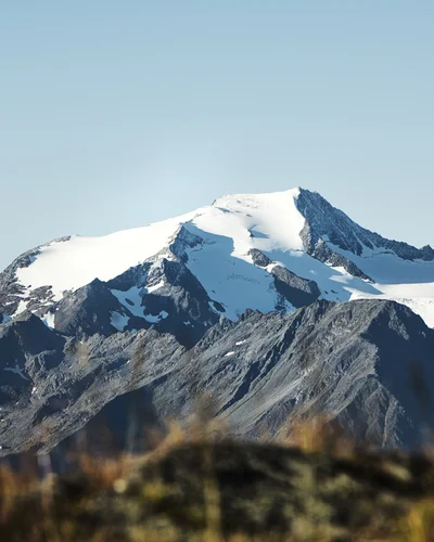 Hotel Alphof | your basecamp for walking holidays in Austria Snow-covered mountain peaks beneath a clear blue sky