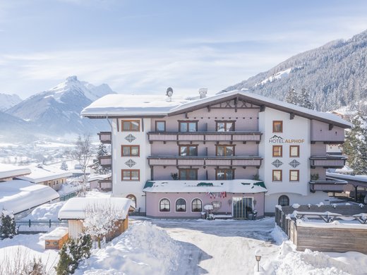 Our hotel in Fulpmes – when can we meet you? Hotel Alphot in snowy winter landscape with mountains in the background