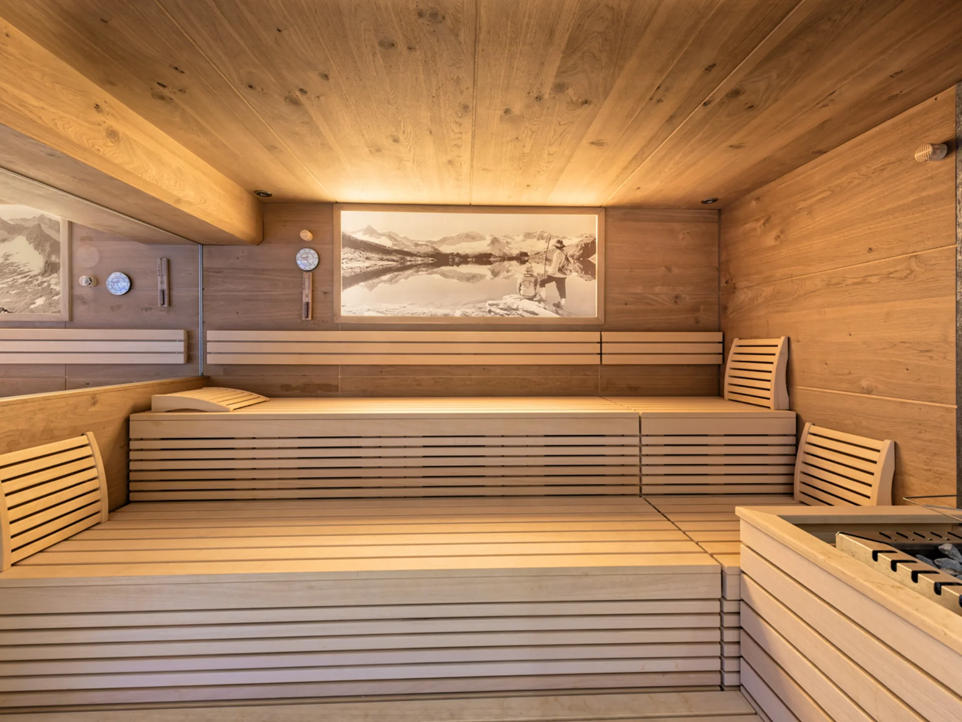 The modern AlpSpa at your spa hotel in Tyrol Wooden sauna with benches, backrests and sauna heater
