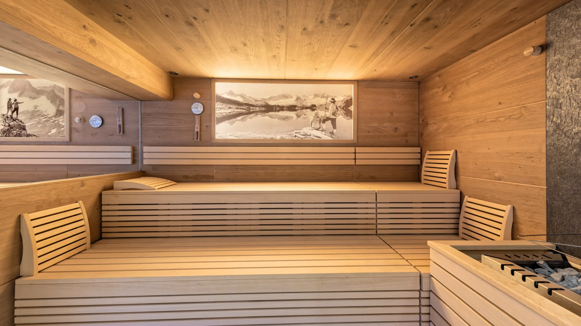 Wooden sauna with benches, backrests and sauna heater